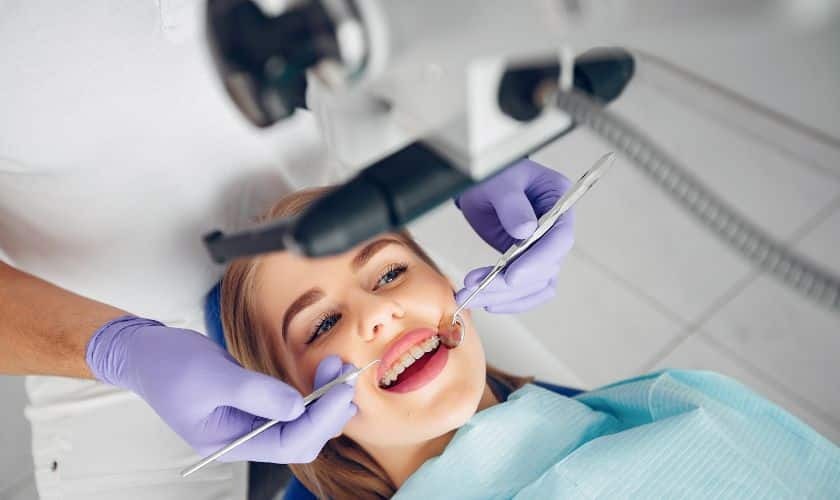 Smiling patient receiving sedation dentistry treatment from dentist in Puyallup.