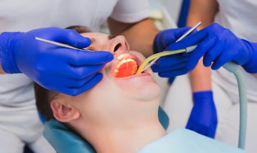 Dentist examining patient's teeth during gum disease prevention consultation in Puyallup.