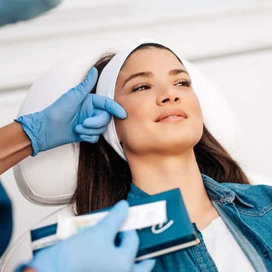 Patient receiving Botox injection treatment from dental professional in Puyallup.