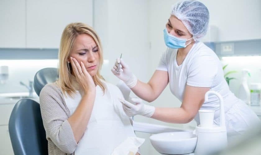 Dentist preparing injection for patient at dental office in Puyallup.