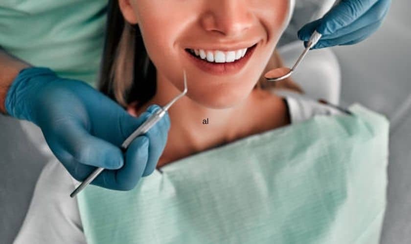 Smiling patient receiving dental examination from dentist in Puyallup.