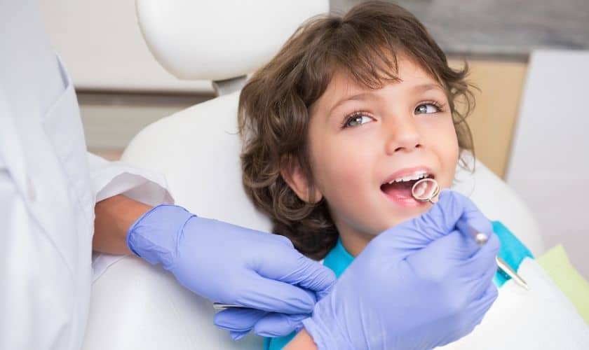 Young child receiving dental examination from pediatric dentist in Puyallup.