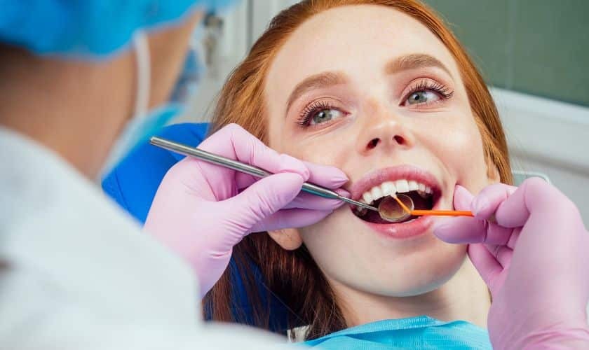 Patient receiving cosmetic dental treatment in Puyallup with dentist using professional instruments.