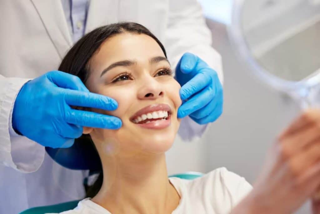 Dentist examining patient's smile during cosmetic dental consultation in Puyallup.