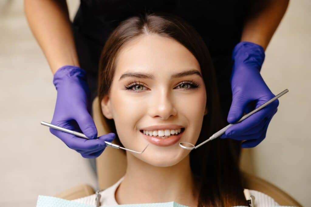 Smiling patient displaying healthy teeth after cosmetic dental treatment in Puyallup.