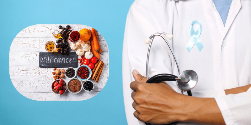 Healthcare professional holding stethoscope next to anti-cancer foods and herbs on white wooden surface.