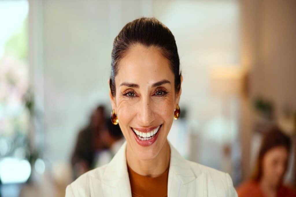 Professional female dentist smiling in modern dental office setting in Puyallup.